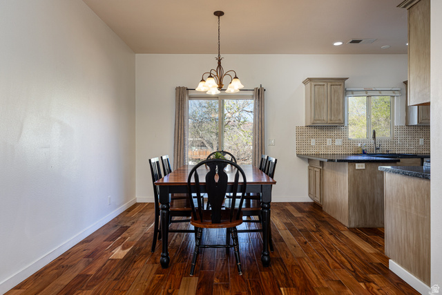 6 300th Road North, Unit I6 Kanab, UT 84741 - Photo 11 of 37 Dining room with suspended lighting and dark wood finished floors