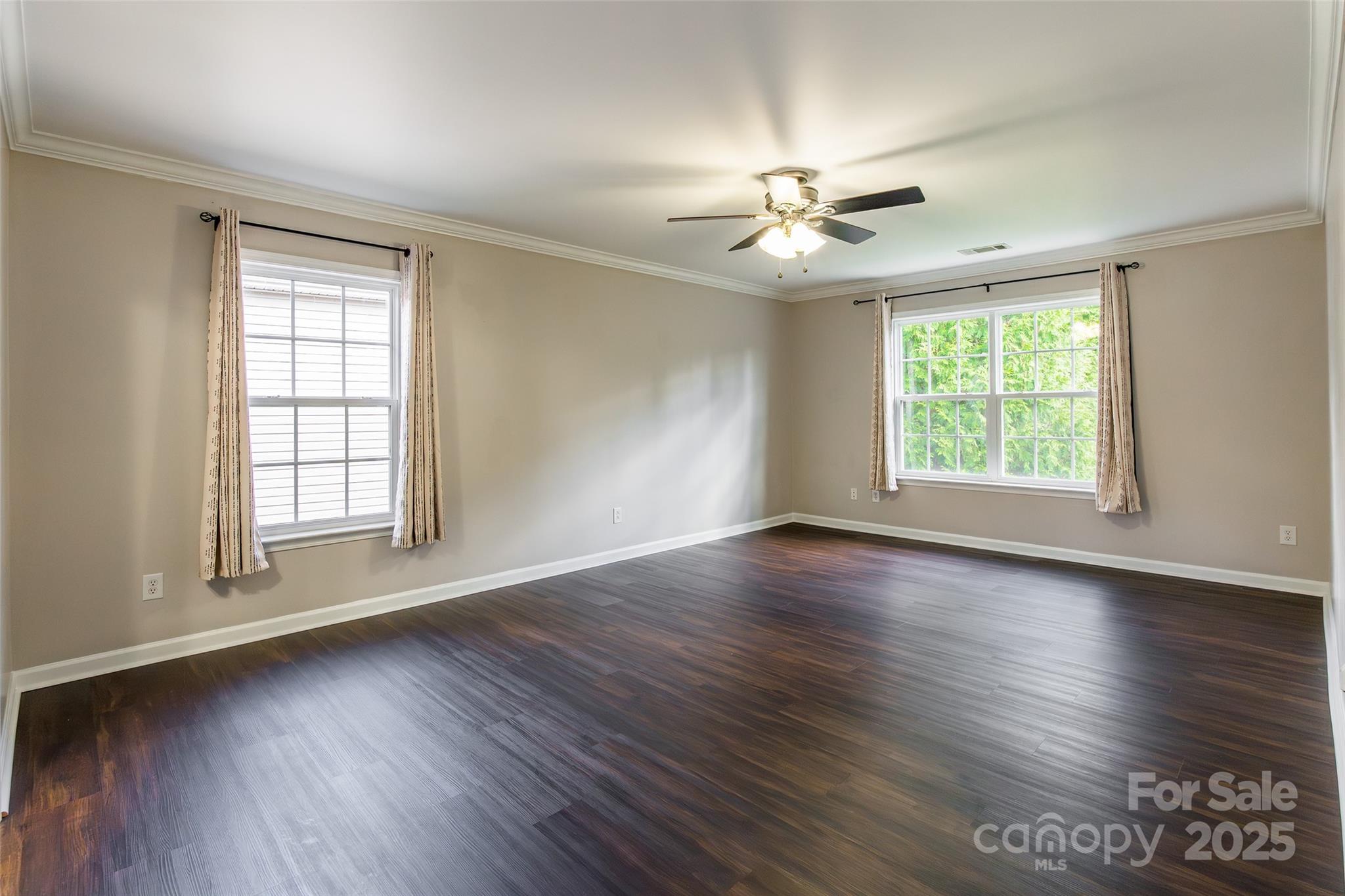 9312 Seamill Road Charlotte, NC 28278 - Photo 16 of 30 a view of an empty room with wooden floor and a window