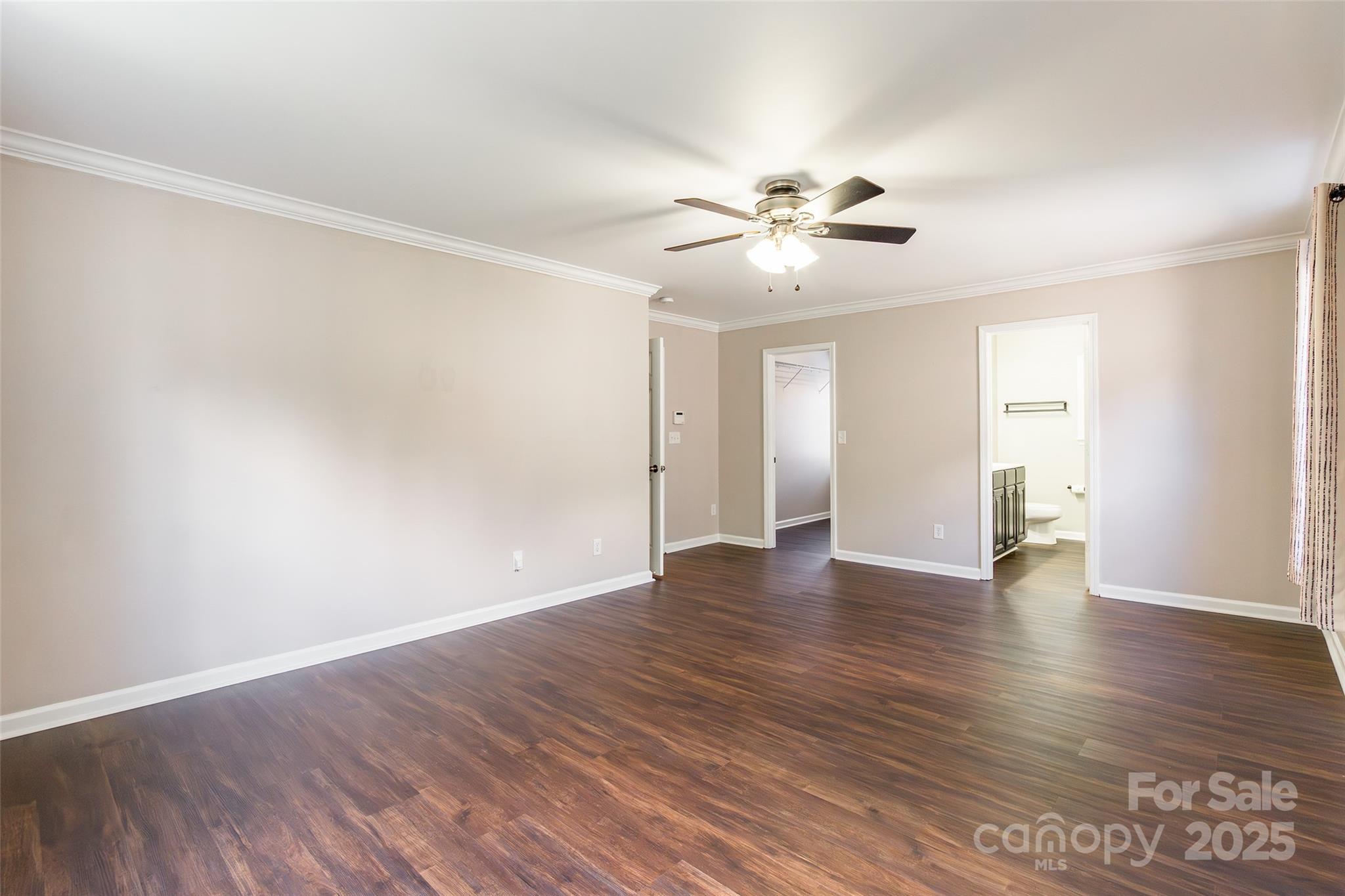 9312 Seamill Road Charlotte, NC 28278 - Photo 18 of 30 a view of an empty room with window and wooden floor