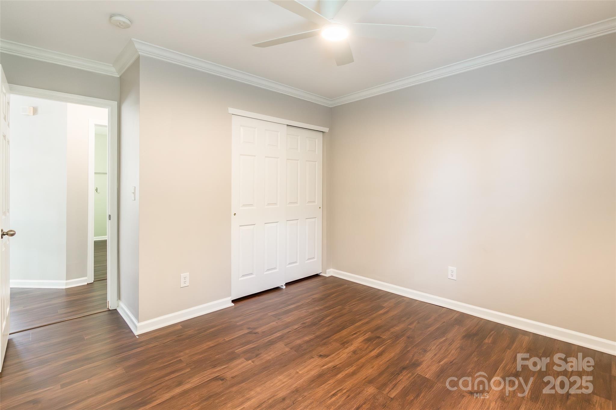 9312 Seamill Road Charlotte, NC 28278 - Photo 22 of 30 a view of an empty room with wooden floor