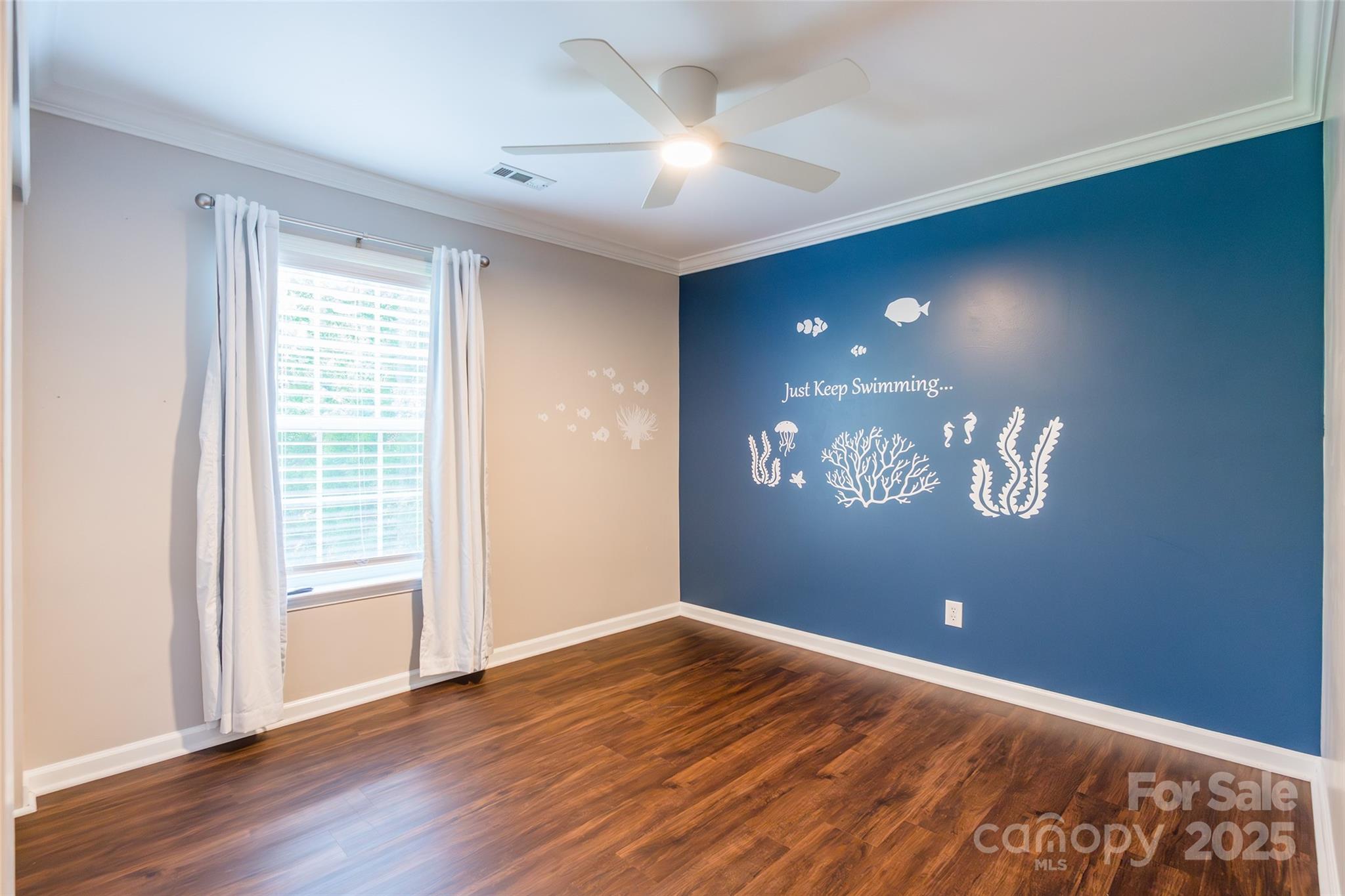9312 Seamill Road Charlotte, NC 28278 - Photo 23 of 30 a view of an empty room with window and wooden floor