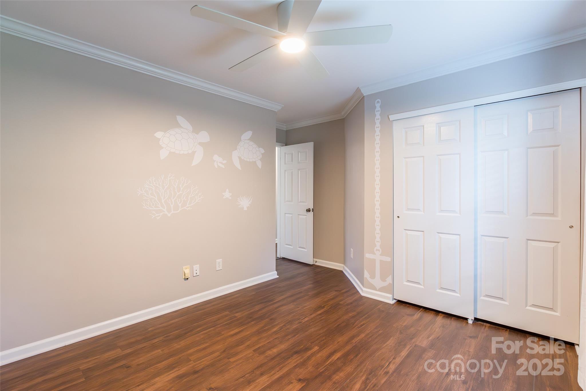9312 Seamill Road Charlotte, NC 28278 - Photo 24 of 30 a view of an empty room with wooden floor
