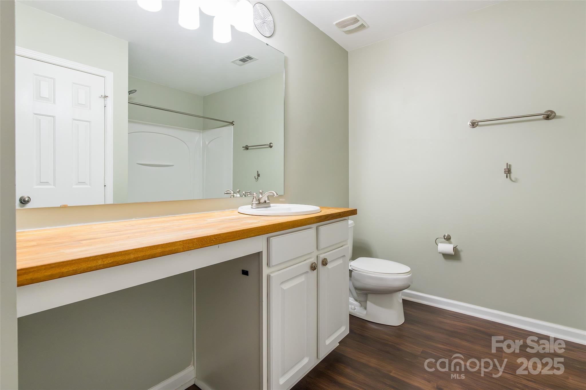 9312 Seamill Road Charlotte, NC 28278 - Photo 25 of 30 a bathroom with a sink a toilet and shower
