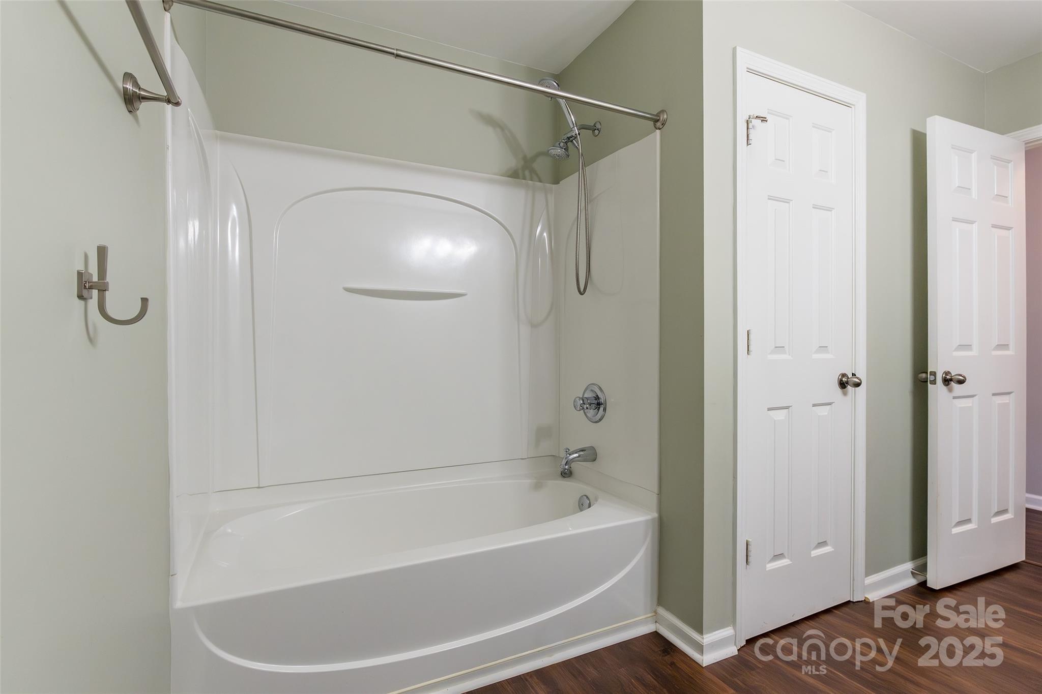 9312 Seamill Road Charlotte, NC 28278 - Photo 26 of 30 a bathroom with a bathtub and a shower