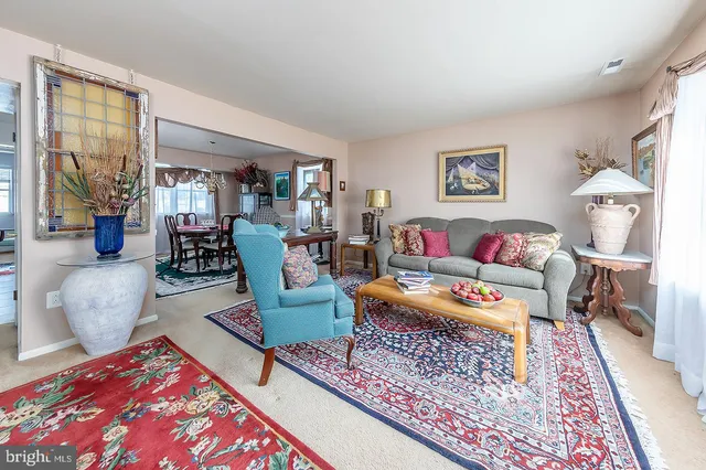 a living room with furniture and a rug