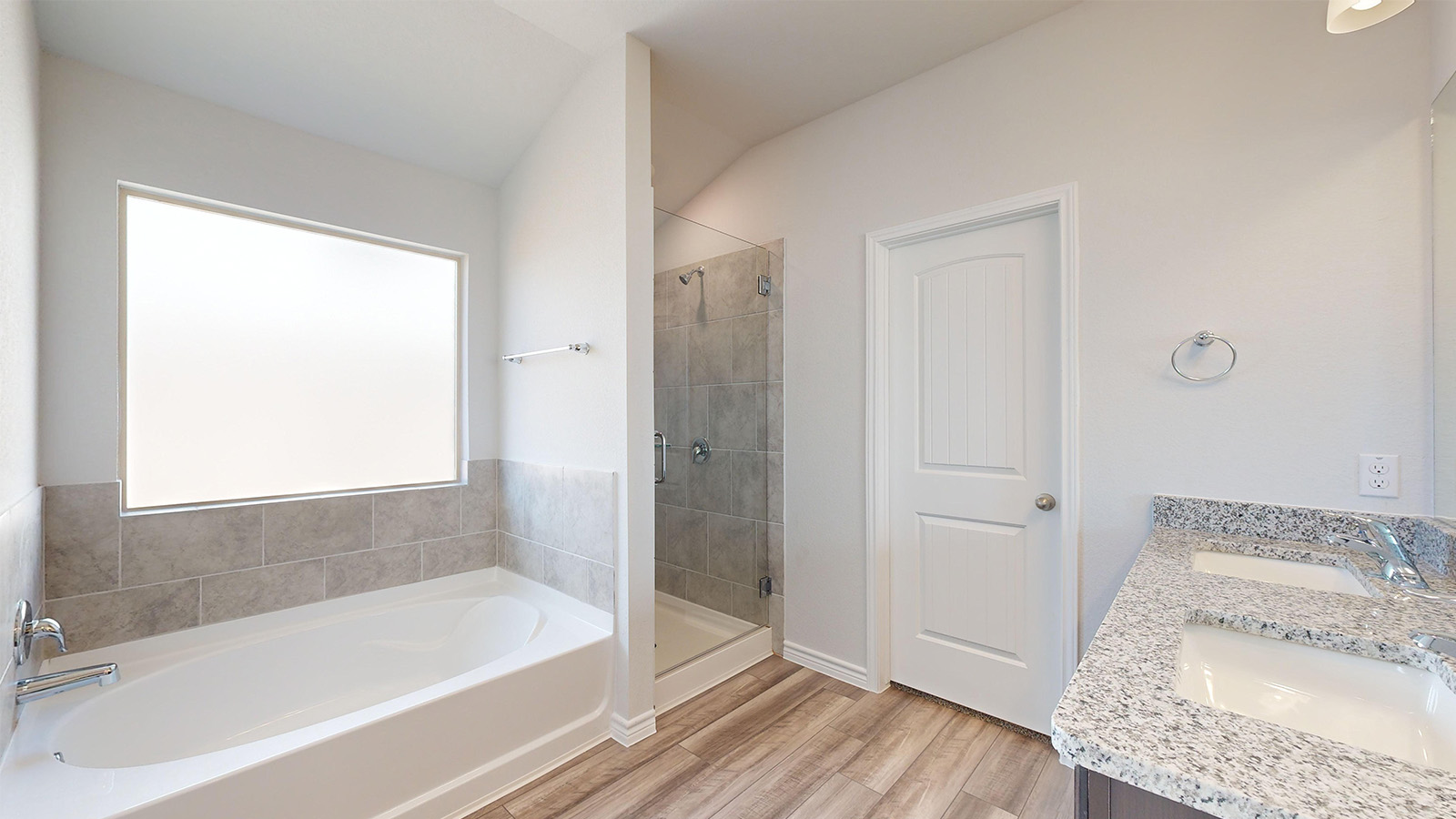 238 Water Wl Road Burnet, TX 78611 - Photo 17 of 33 Bathroom featuring a shower stall, a garden tub, double vanity, and light wood-style flooring