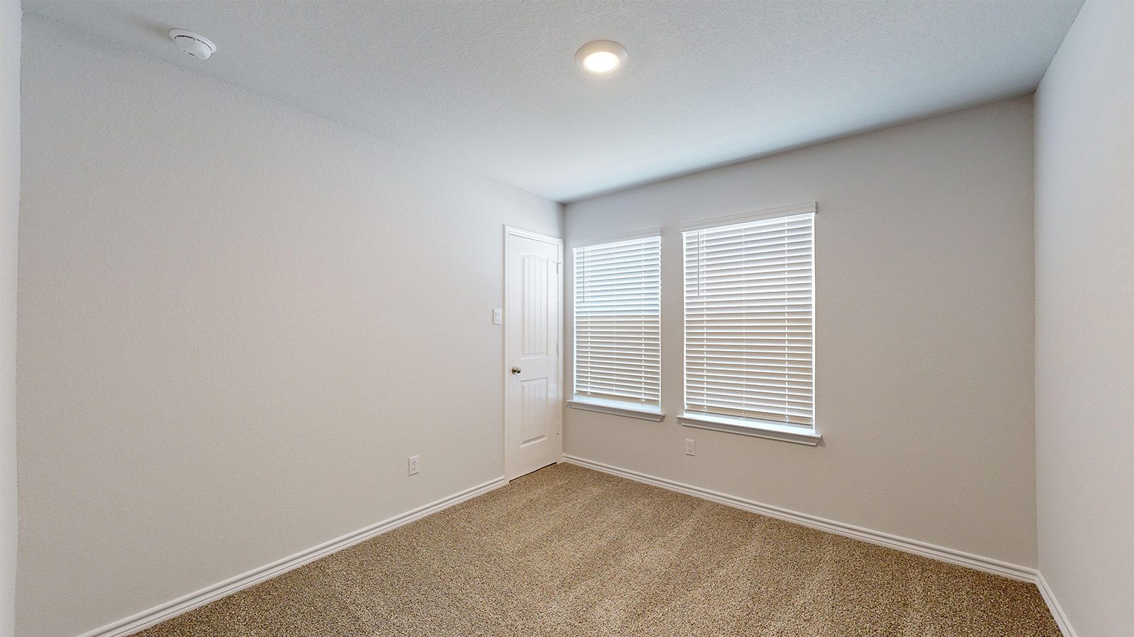 238 Water Wl Road Burnet, TX 78611 - Photo 24 of 33 Carpeted empty room featuring baseboards and a smoke detector