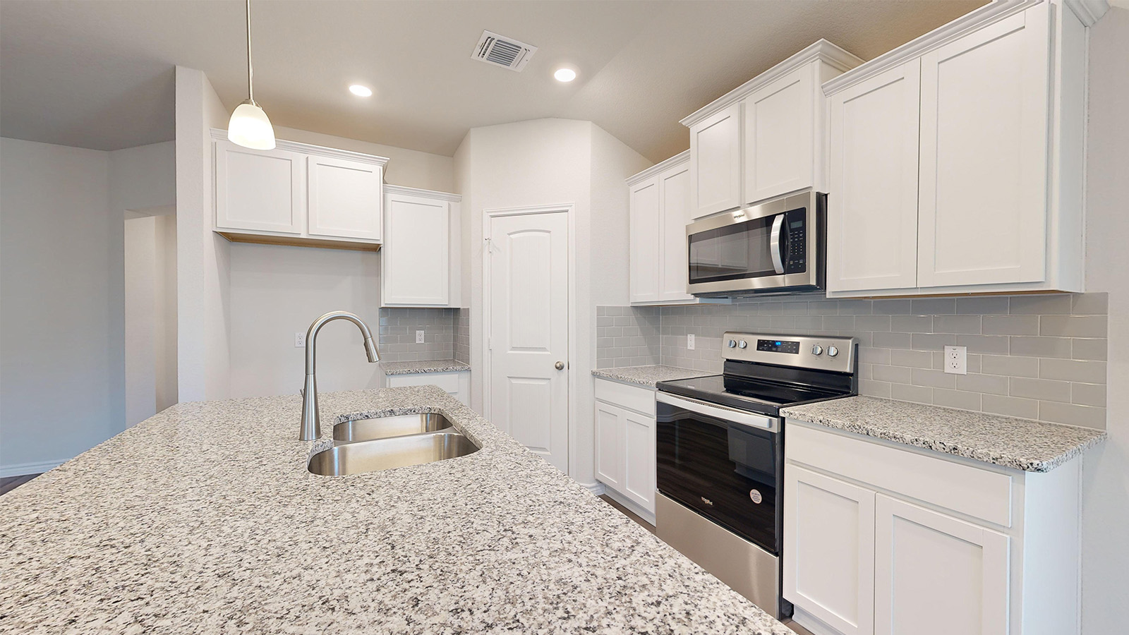 238 Water Wl Road Burnet, TX 78611 - Photo 6 of 33 Kitchen with stainless steel appliances, light stone counters, white cabinets, pendant lighting, and tasteful backsplash