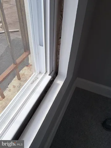 a bathroom with a toilet and a bathtub