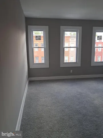 a view of empty room with windows