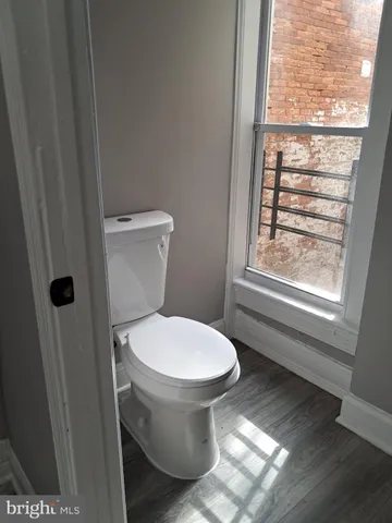 a bathroom with a toilet and a sink