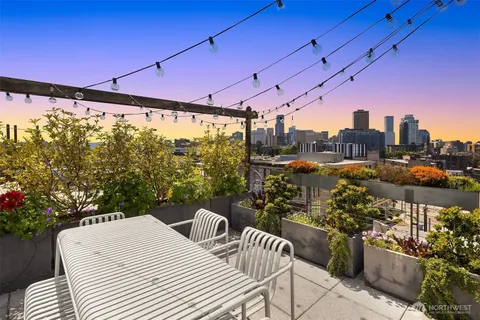 a view of a chairs and table in the patio