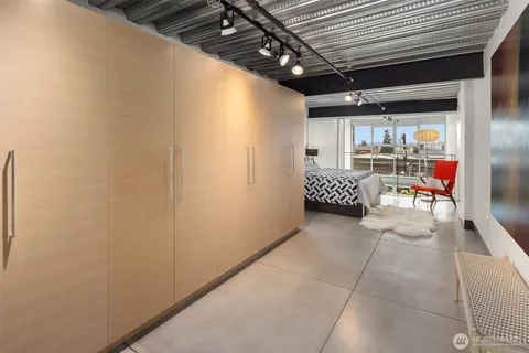 a bedroom with a bed and wall painting