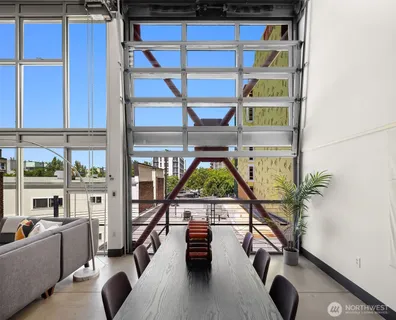 a view of a livingroom with furniture and a window