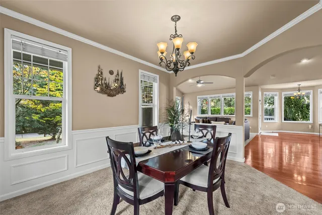 a view of a dining room with furniture window and outside view