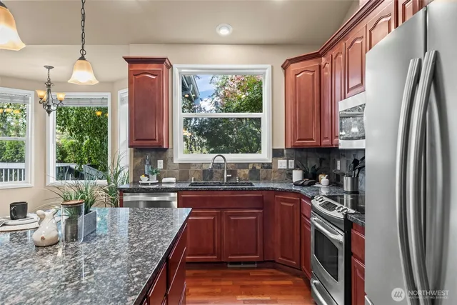 a kitchen with sink cabinets and living room