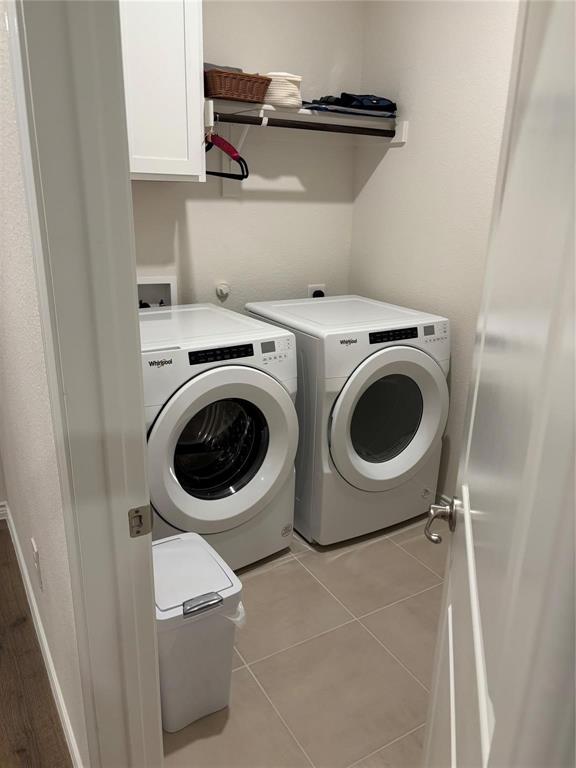 10512 Autumn Leaves Lane Aubrey, TX 76227 - Photo 9 of 9 a utility room with dryer and washer