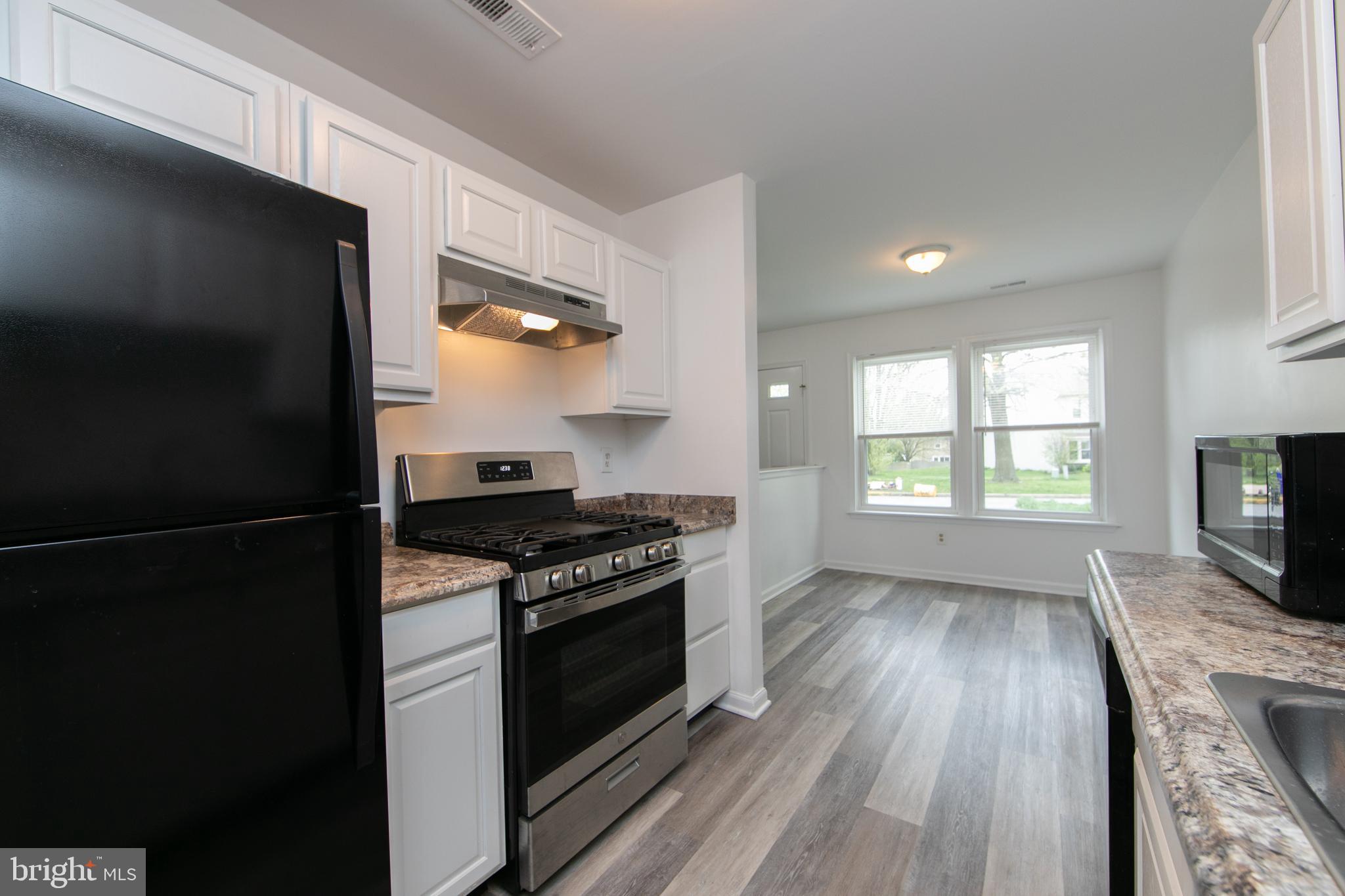 5401 Red Haven Drive Evesham, NJ 08053 - Photo 13 of 35 a kitchen with a stove and a microwave