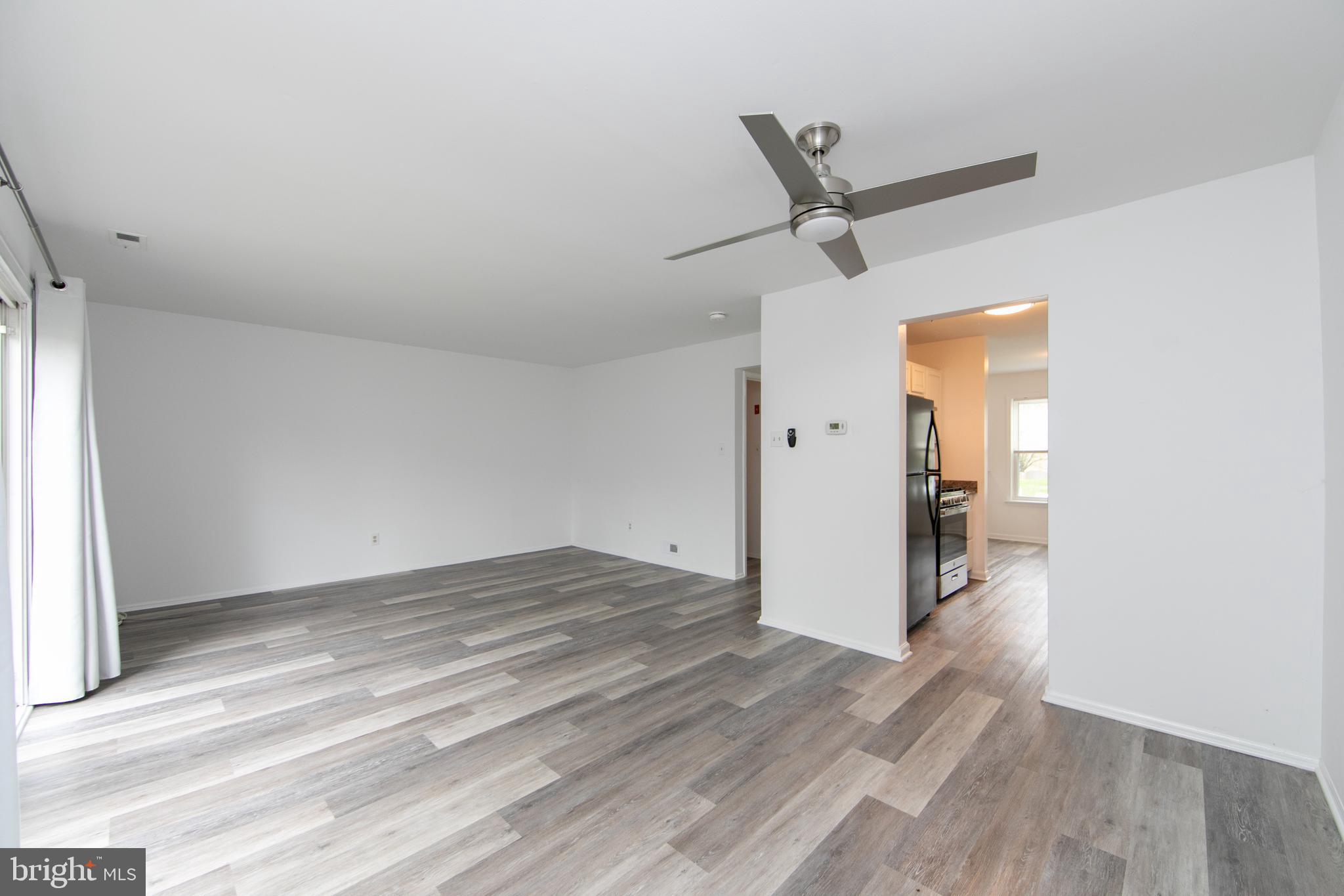 5401 Red Haven Drive Evesham, NJ 08053 - Photo 15 of 35 an empty room with wooden floor and ceiling fan