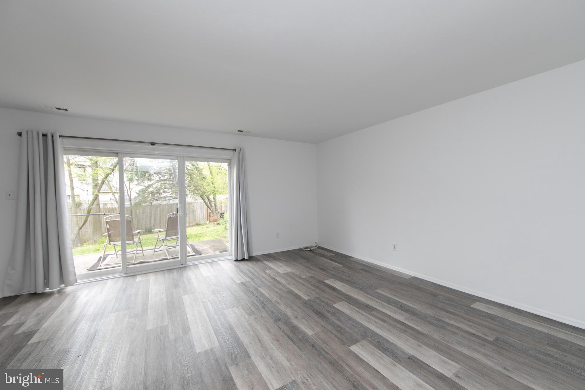 5401 Red Haven Drive Evesham, NJ 08053 - Photo 17 of 35 an empty room with wooden floor and windows
