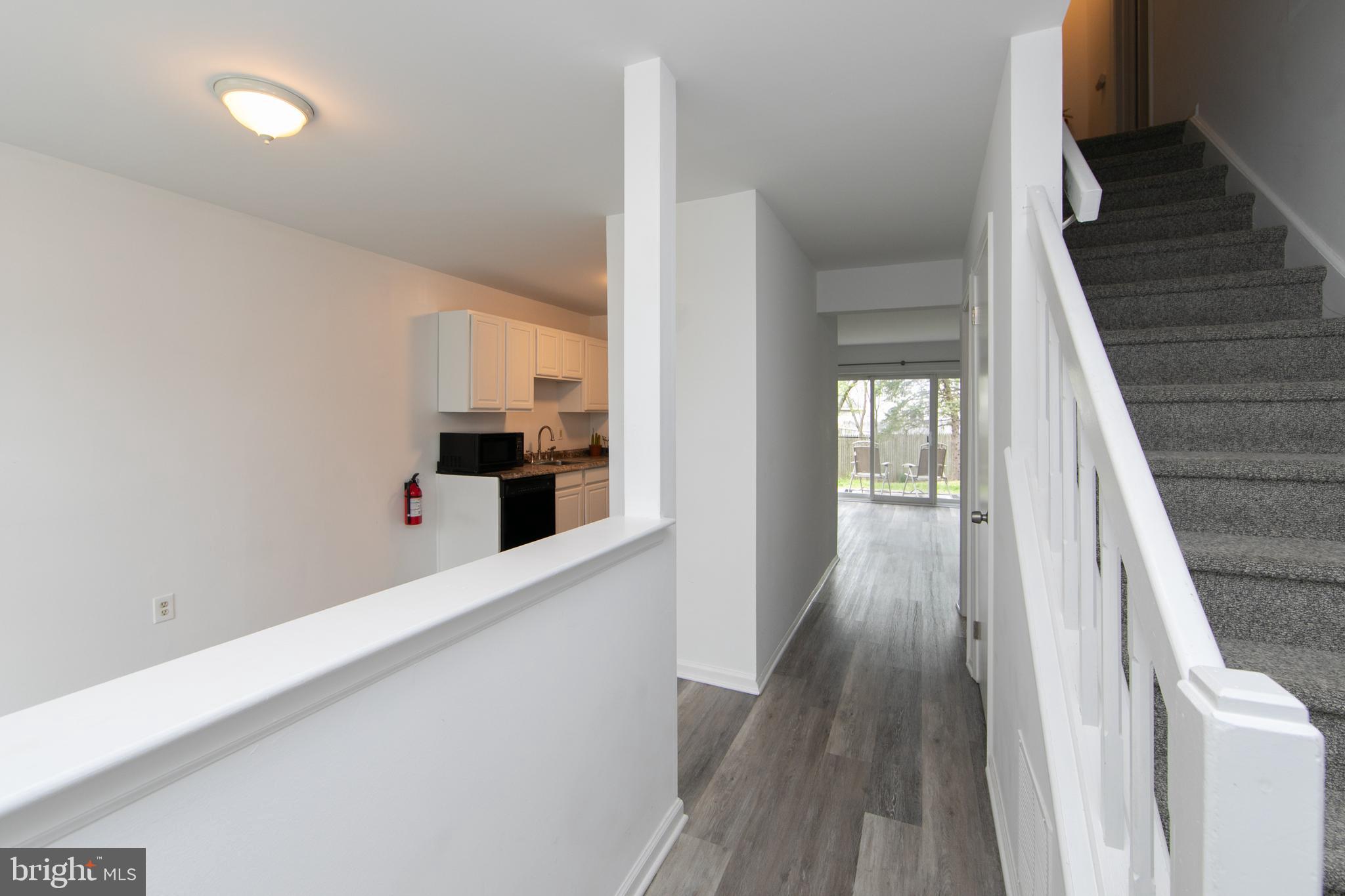 5401 Red Haven Drive Evesham, NJ 08053 - Photo 7 of 35 a hallway with wooden floor and staircase