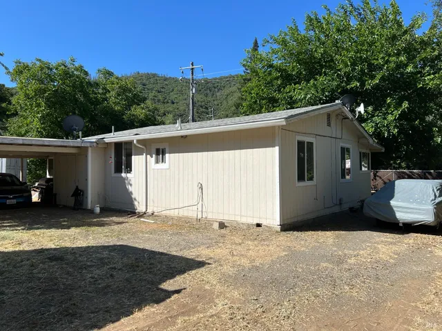 a house with trees in the background