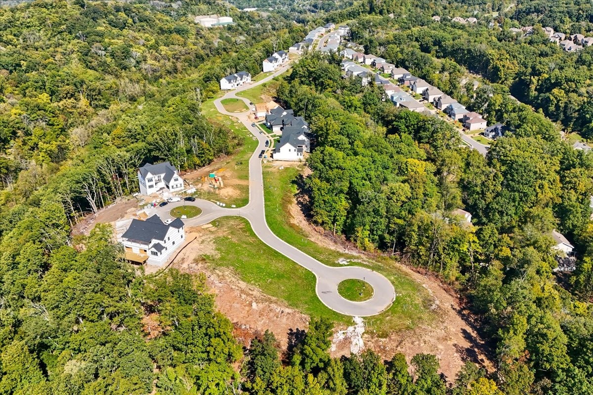 908 Spring Ridge Court Nashville, TN 37221 - Photo 5 of 7 an aerial view of a house with a yard and large trees