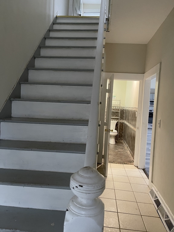 67-69 Loring Street Lowell, MA 01851 - Photo 15 of 16 a view of entryway and hall with wooden floor