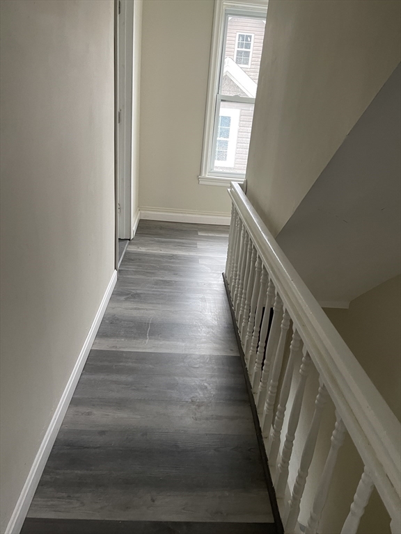 67-69 Loring Street Lowell, MA 01851 - Photo 8 of 16 a view of entryway and hall with wooden floor