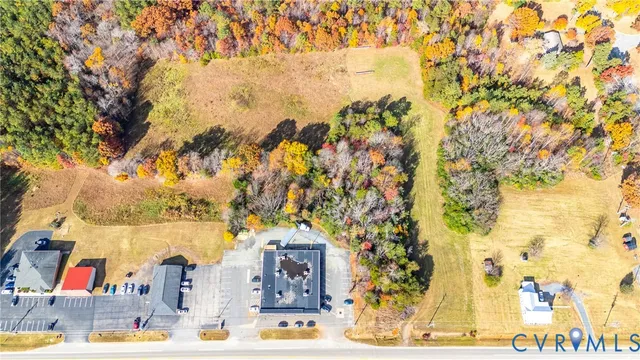 a view of residential houses with outdoor space and street view