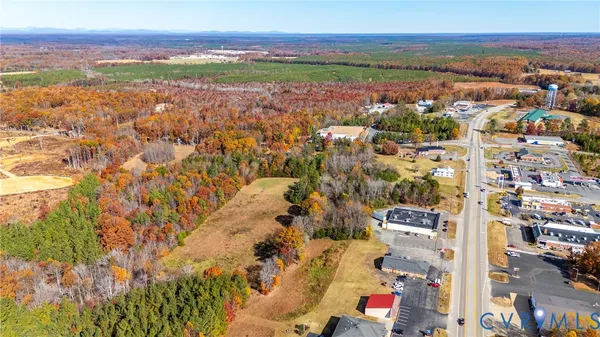 an aerial view of residential building and lake