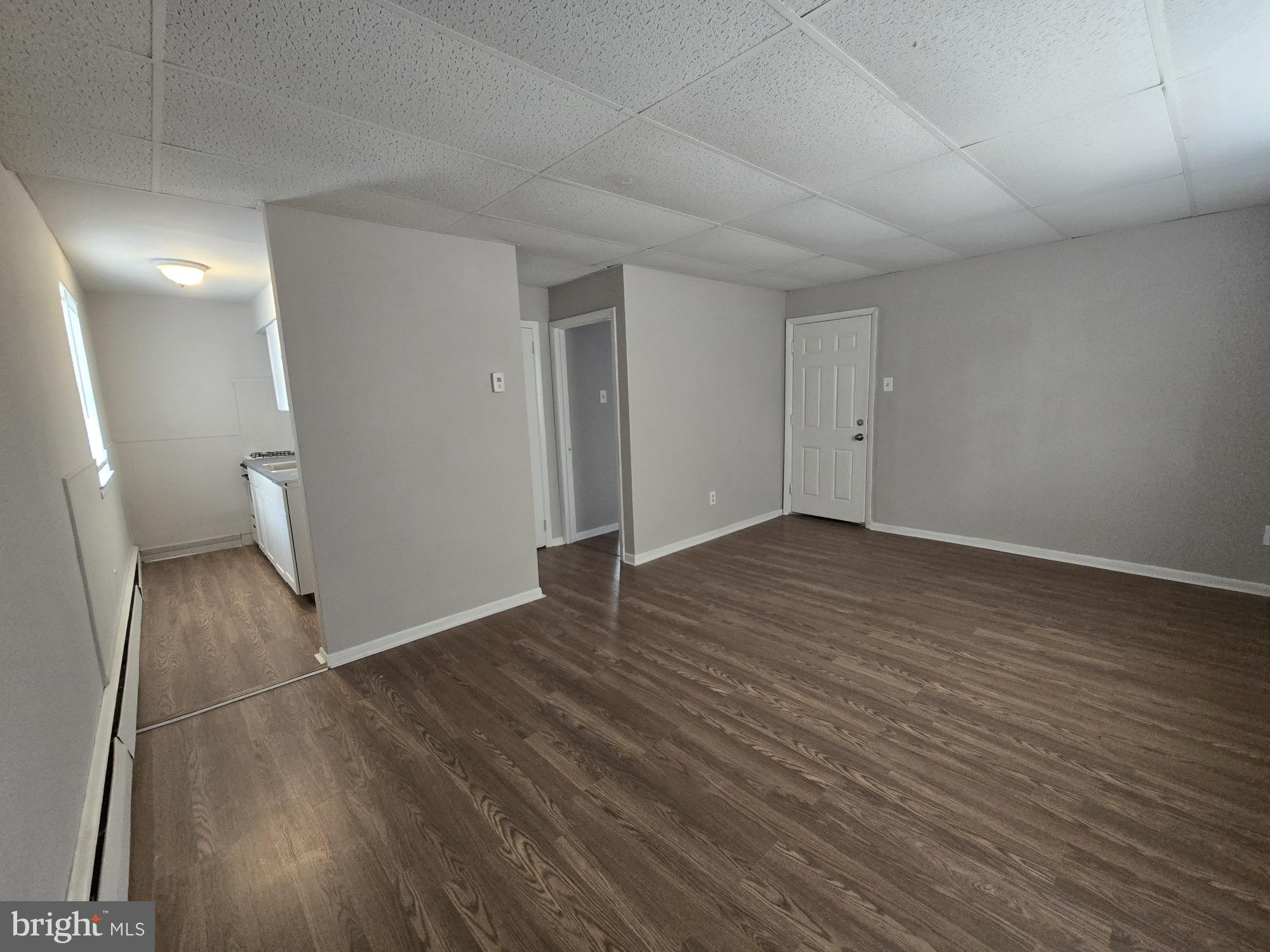 5302 Duffield Street Philadelphia, PA 19124 - Photo 6 of 12 wooden floor in an empty room with a window