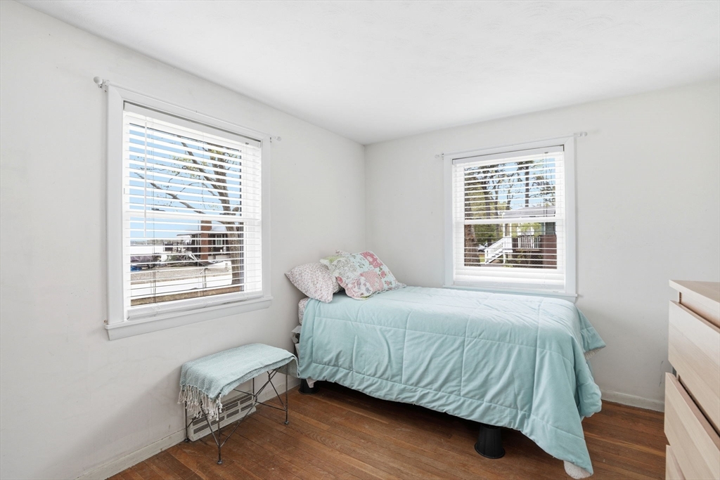 94 Edgewater Drive Wareham, MA 02571 - Photo 29 of 37 a bedroom with a bed window and wooden floor