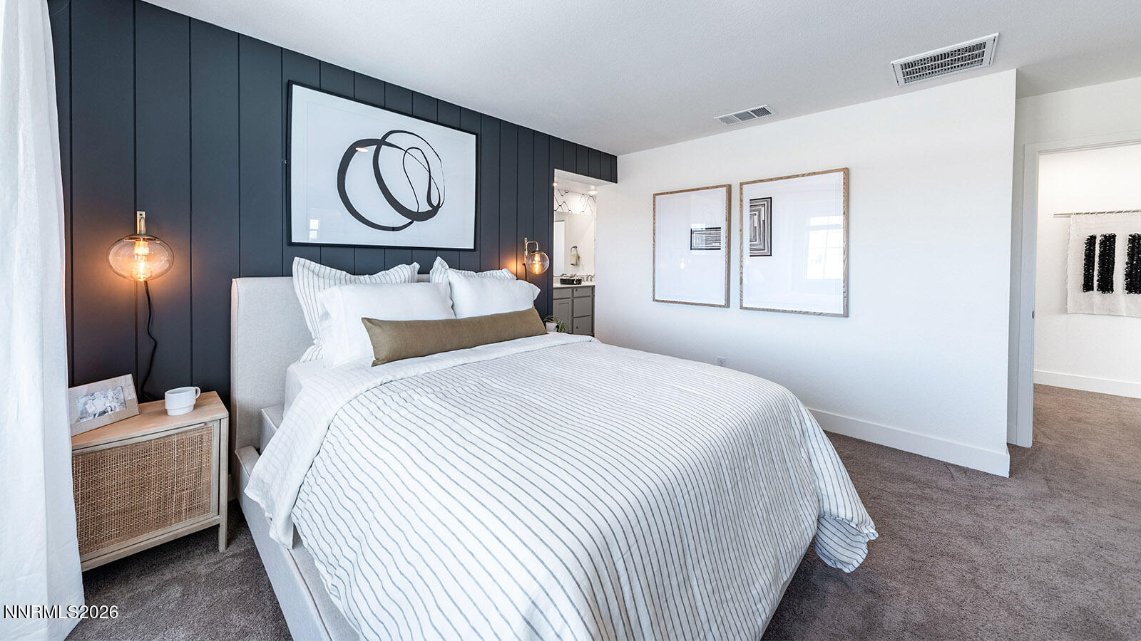 7587 Plump Jack Lane Reno, NV 89506 - Photo 8 of 13 a bedroom with a bed and a chandelier