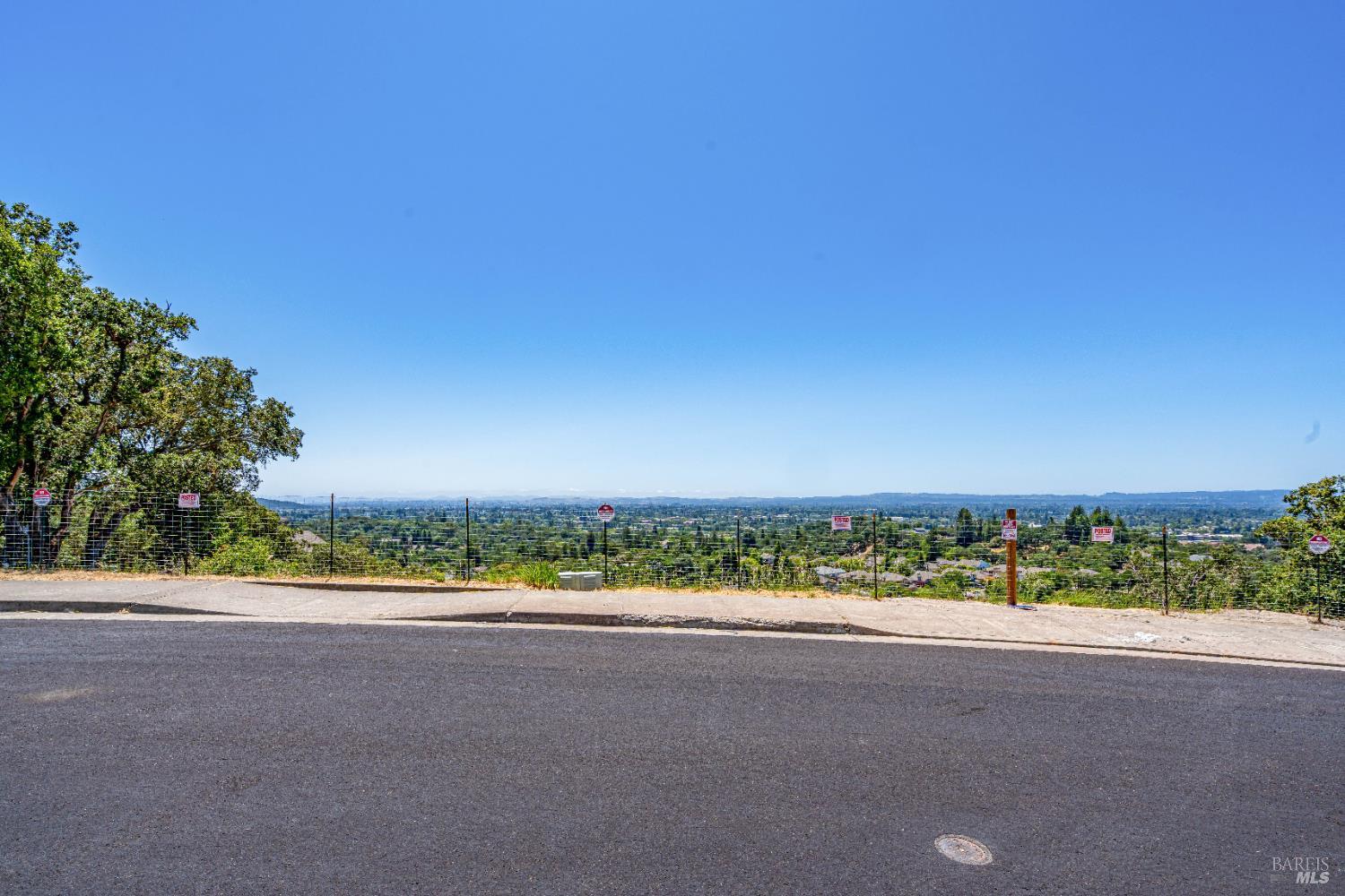 3577 Kelsey Knolls Santa Rosa, CA 95403 - Photo 7 of 20 a view of a road with a building in the background