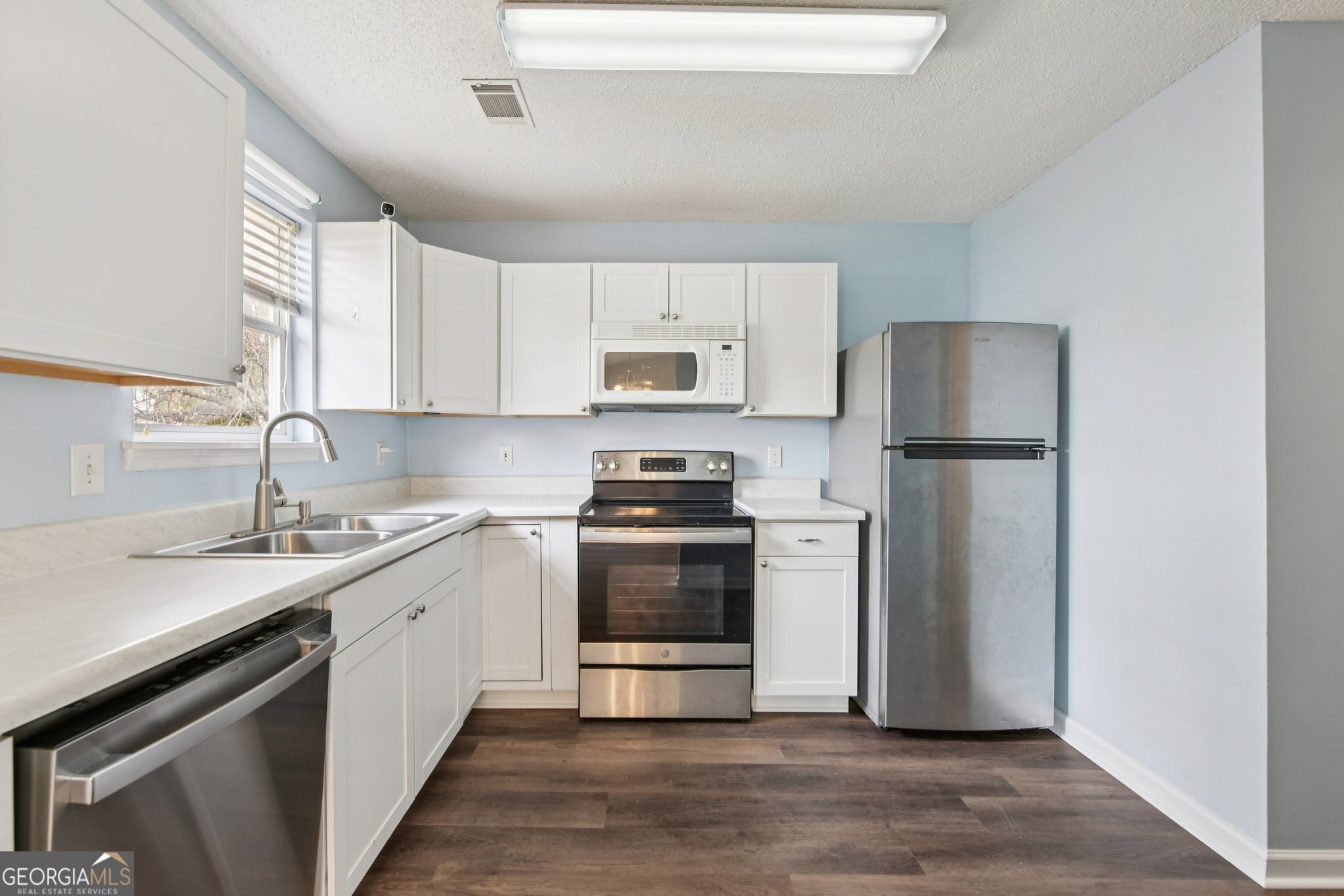 269 Buckingham Court Athens, GA 30607 - Photo 13 of 35 a kitchen with a sink and a stove top oven