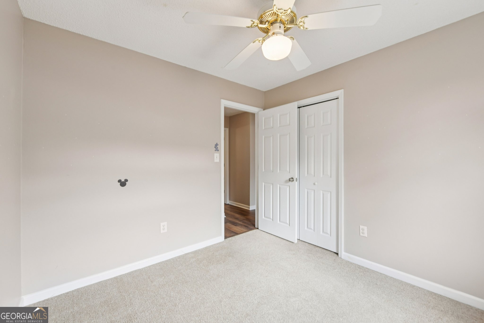 269 Buckingham Court Athens, GA 30607 - Photo 22 of 35 an empty room with a chandelier fan and closet