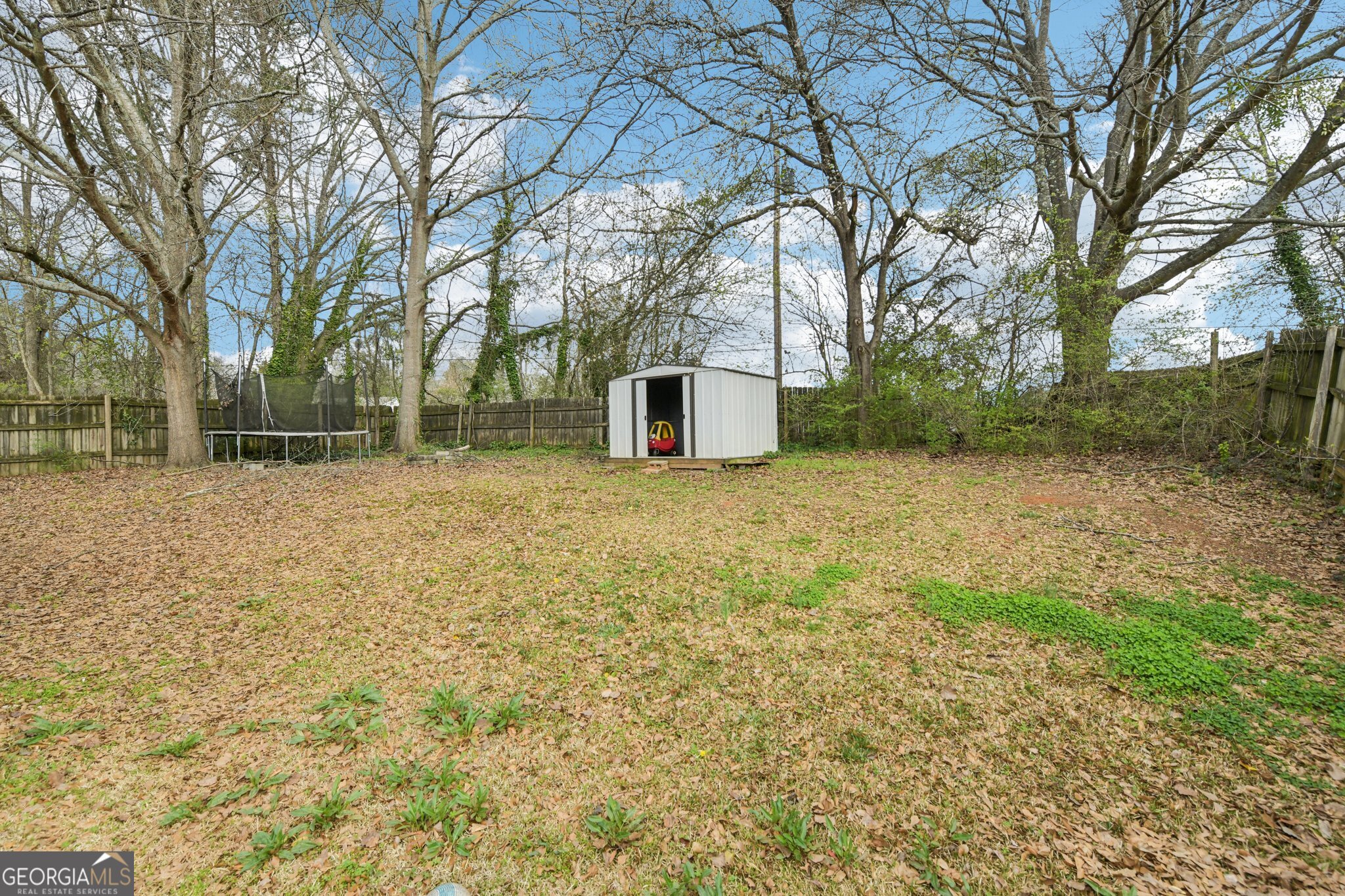 269 Buckingham Court Athens, GA 30607 - Photo 34 of 35 a view of a backyard with large trees