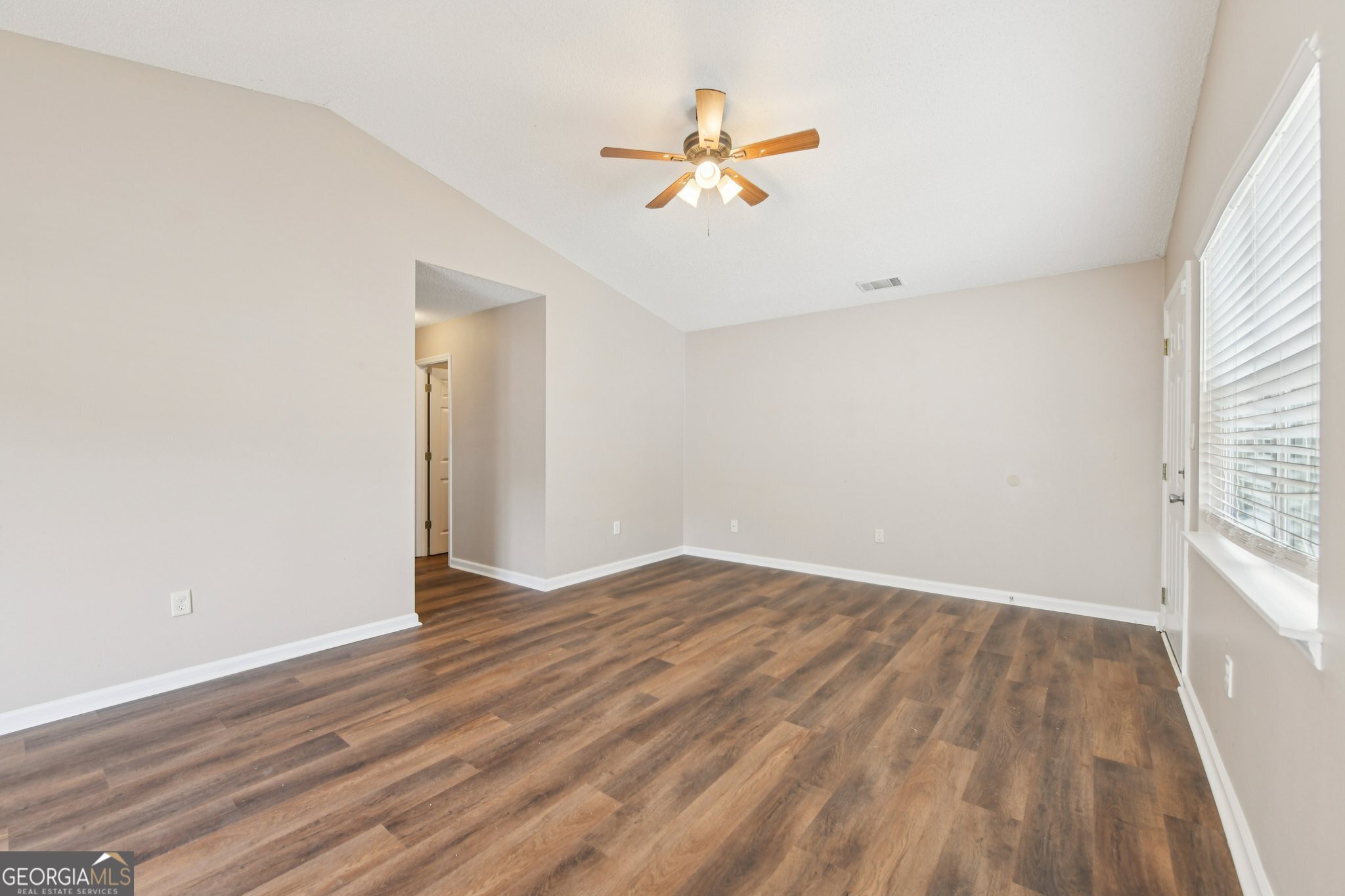 269 Buckingham Court Athens, GA 30607 - Photo 9 of 35 wooden floor in an empty room with a window