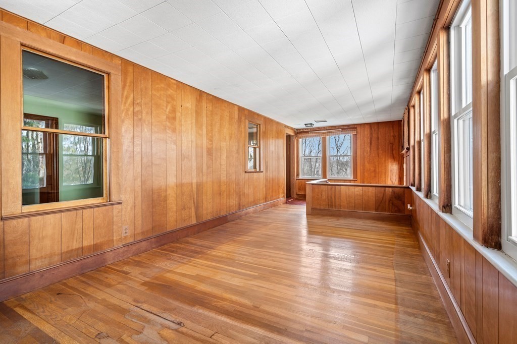 13 Dearborn Road Methuen, MA 01844 - Photo 12 of 39 a view of empty room with wooden floor and fan