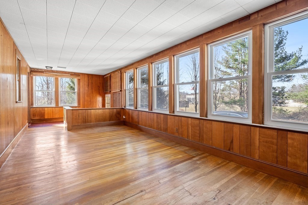 13 Dearborn Road Methuen, MA 01844 - Photo 13 of 39 a view of an empty room with wooden floor and a window