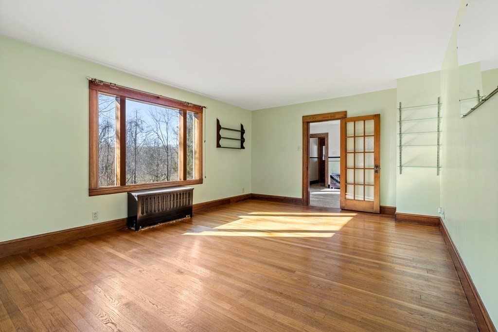 13 Dearborn Road Methuen, MA 01844 - Photo 18 of 39 an empty room with wooden floor and windows