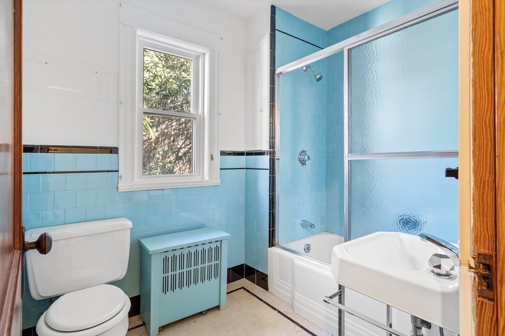 13 Dearborn Road Methuen, MA 01844 - Photo 21 of 39 a bathroom with a sink a toilet and shower