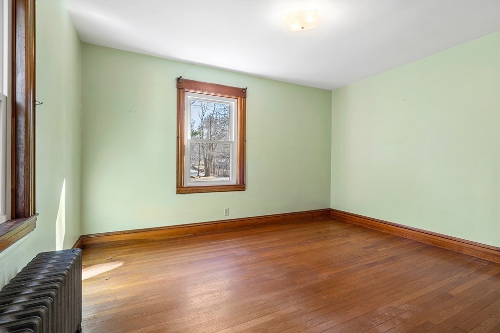 13 Dearborn Road Methuen, MA 01844 - Photo 24 of 39 an empty room with wooden floor and window