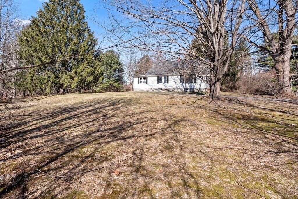 13 Dearborn Road Methuen, MA 01844 - Photo 4 of 39 a view of a yard with a tree