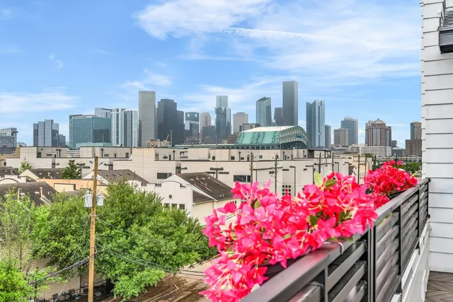 a street view with tall buildings