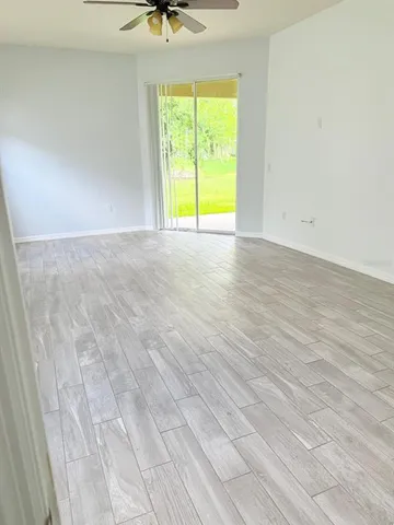 a view of an empty room with a window