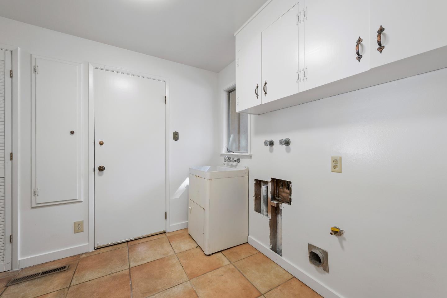 2 Lowery Drive Atherton, CA 94027 - Photo 12 of 32 a view of a storage and utility room with a washer dryer