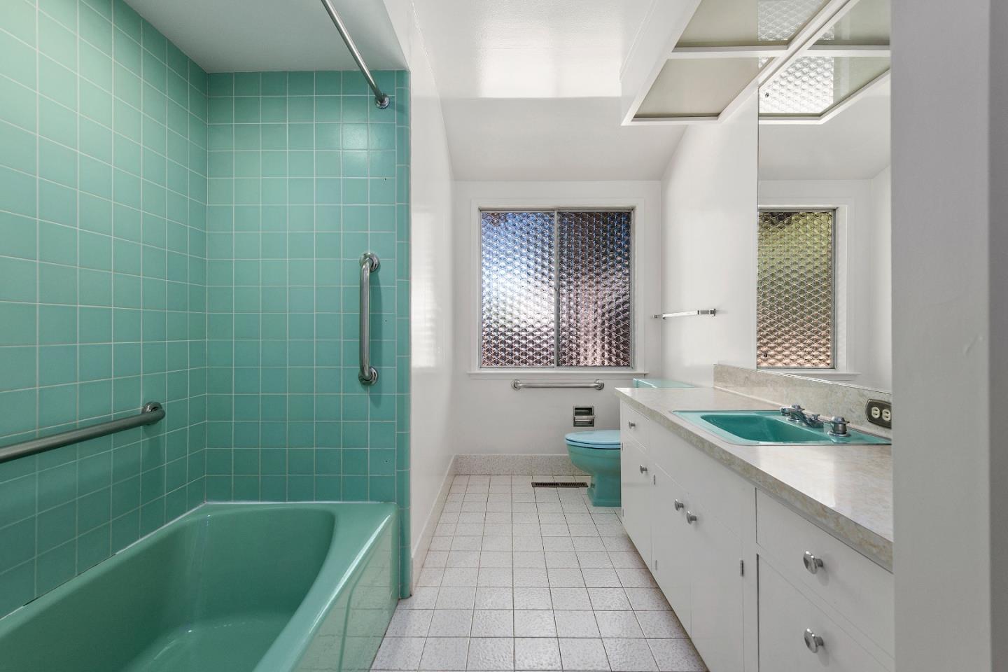 2 Lowery Drive Atherton, CA 94027 - Photo 22 of 32 a bathroom with a granite countertop sink a toilet a mirror and bathtub