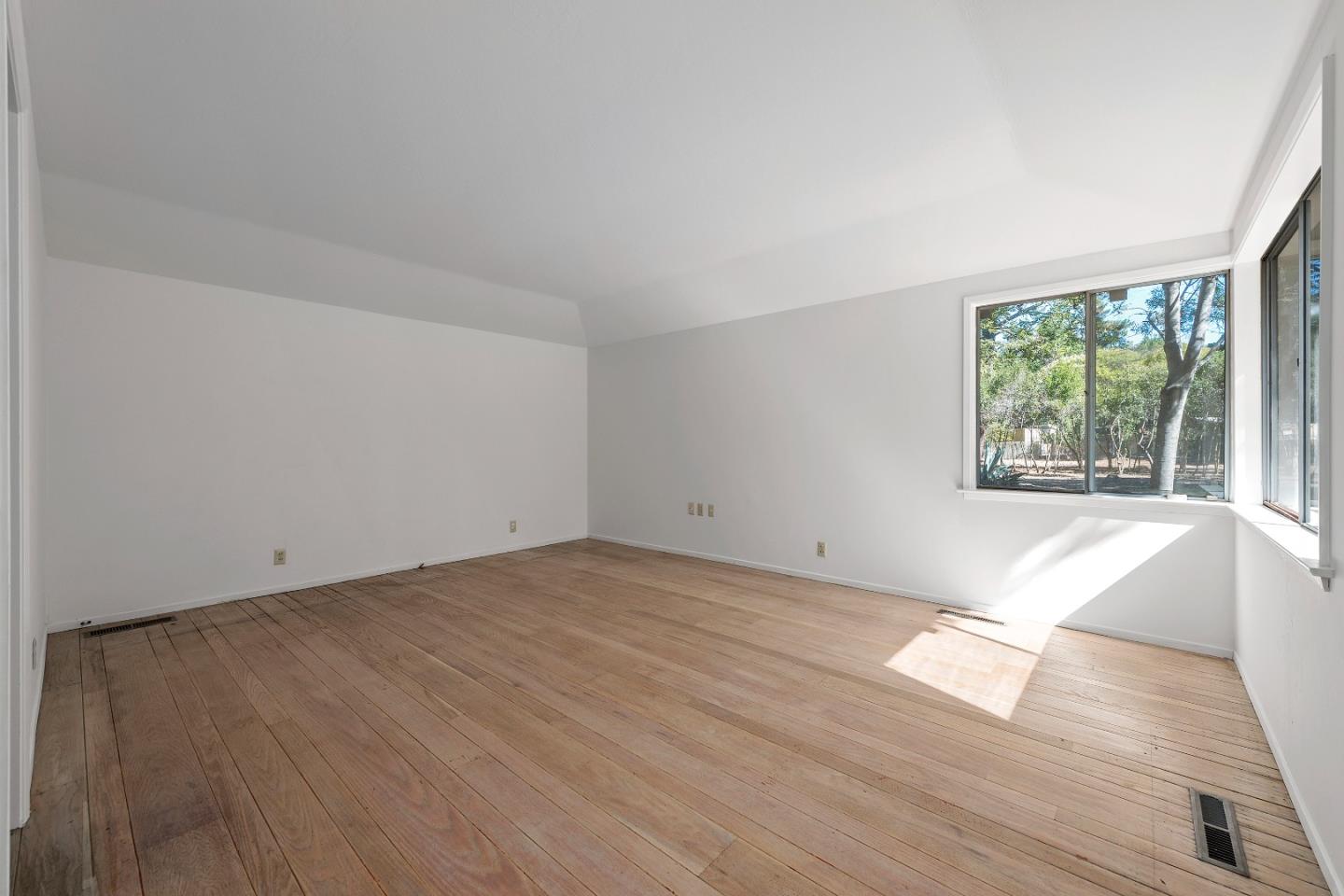 2 Lowery Drive Atherton, CA 94027 - Photo 24 of 32 an empty room with wooden floor and windows